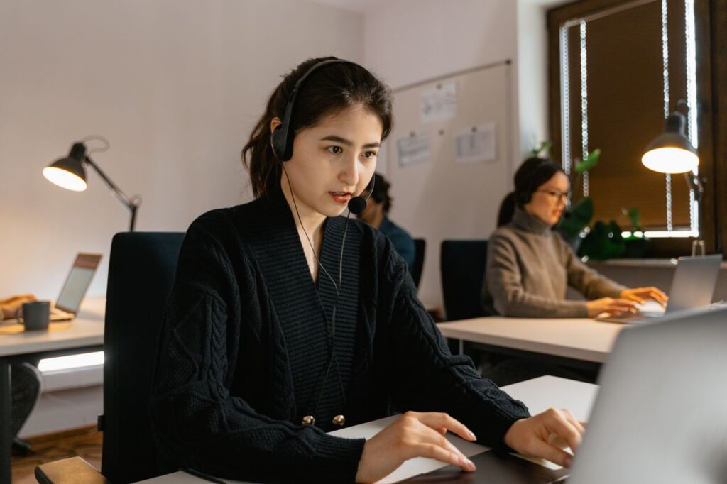 Mastering the First Impression: Your intriguing post title goes here Focused call center agents working with headsets in a modern office environment.